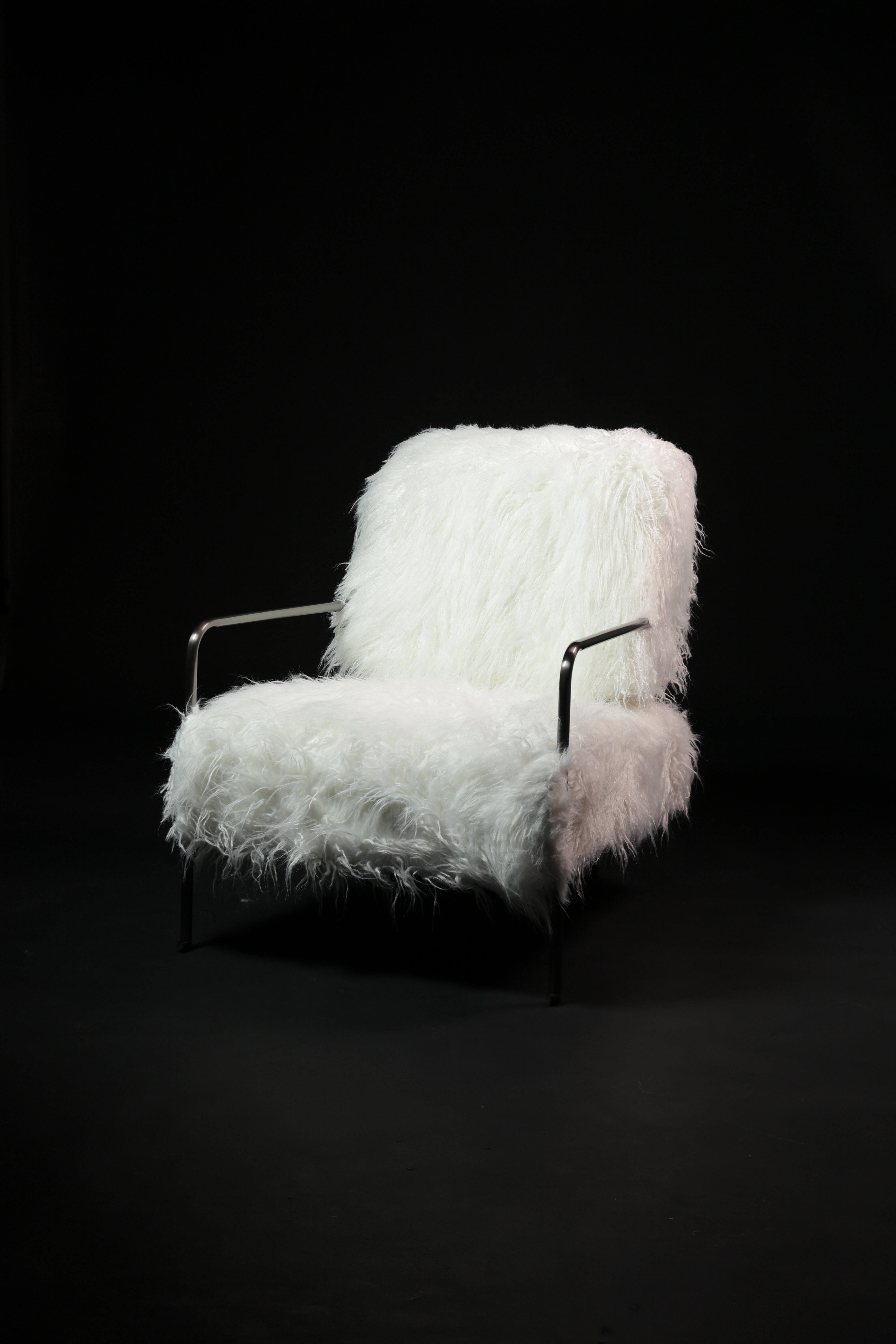 White feathered chair on a black background