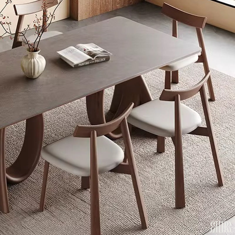 Dining table set with chairs in a modern interior setting