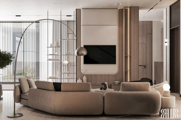 Modern living room with a large curved sofa, TV, and decorative items.
