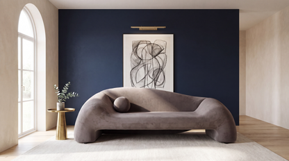 Aurelia Collection curved designer sofa in a modern minimalist living room