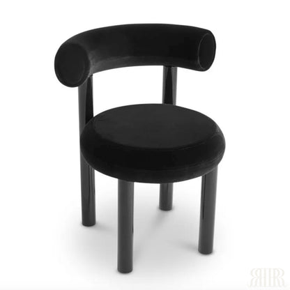 Black chair with curved backrest on a white background