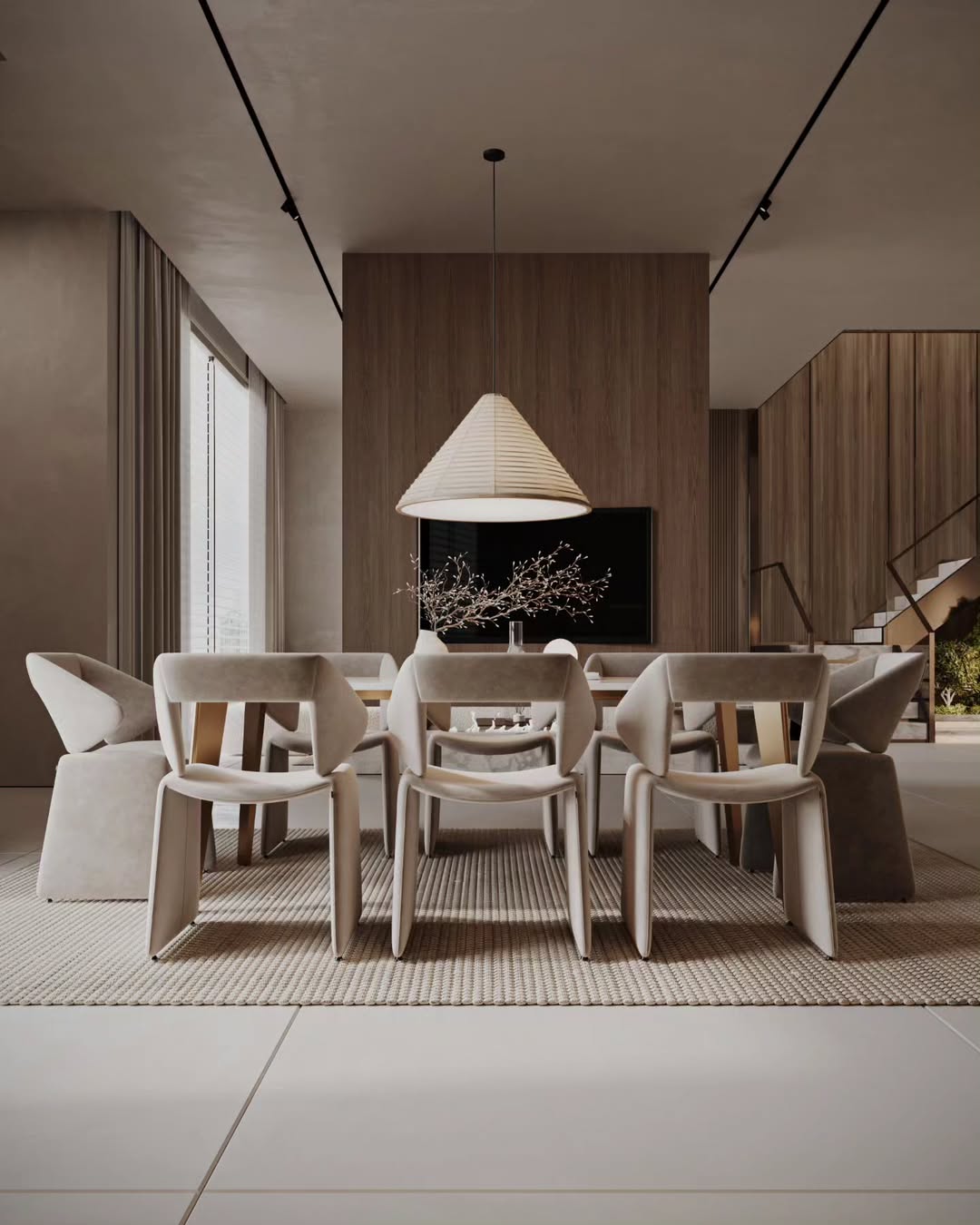 Modern dining room with neutral tones and a large window.