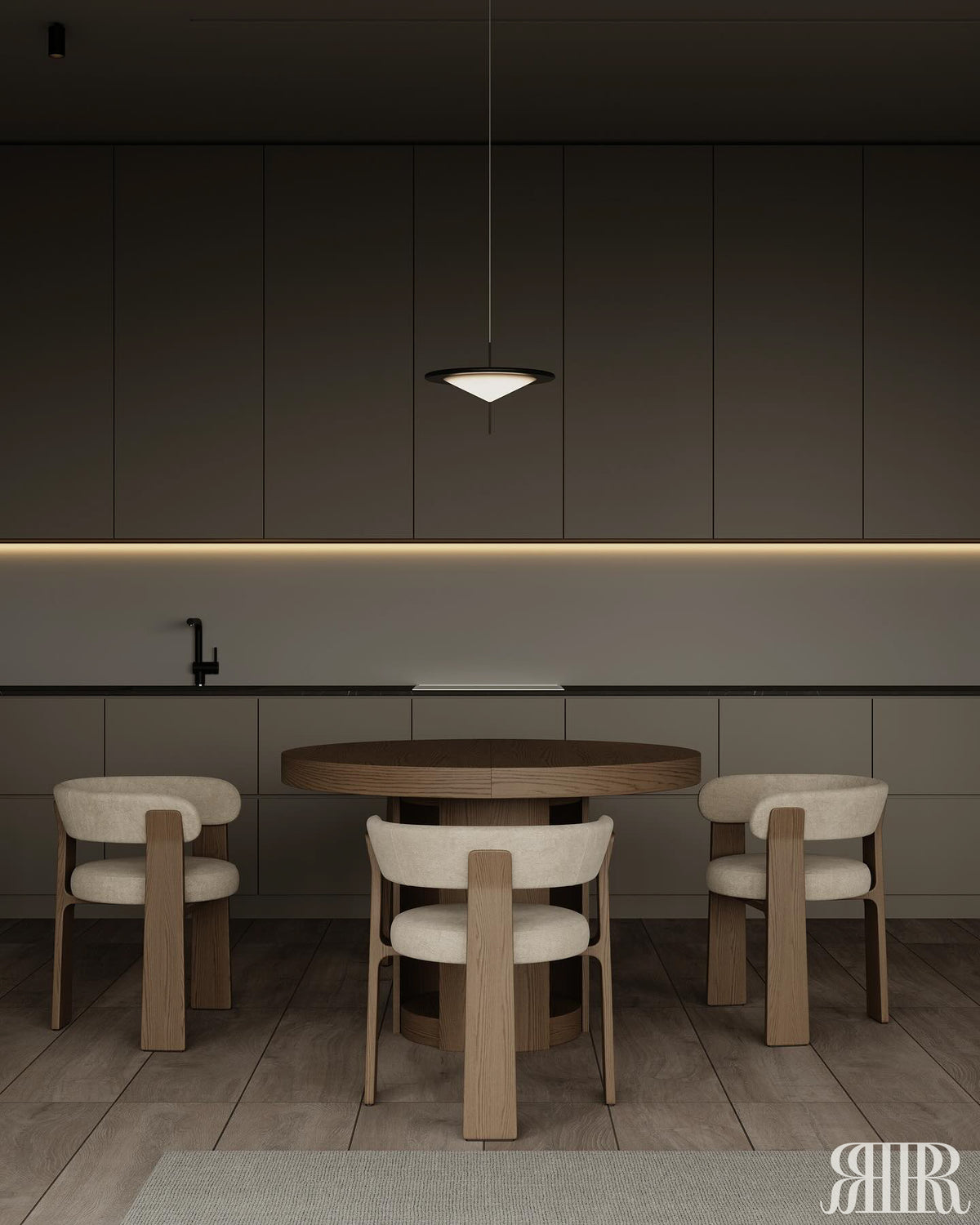 Dining area with a round wooden table and four chairs in a modern kitchen.