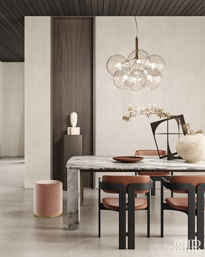 Modern dining room with marble table, chairs, and decorative elements.