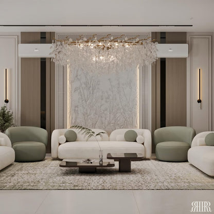 Modern living room with white sofa, green armchairs, and chandelier.