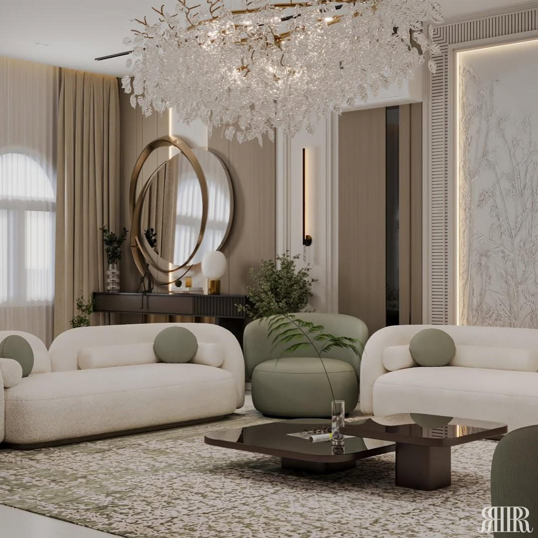 Modern living room with white sofa, green armchair, and decorative chandelier.