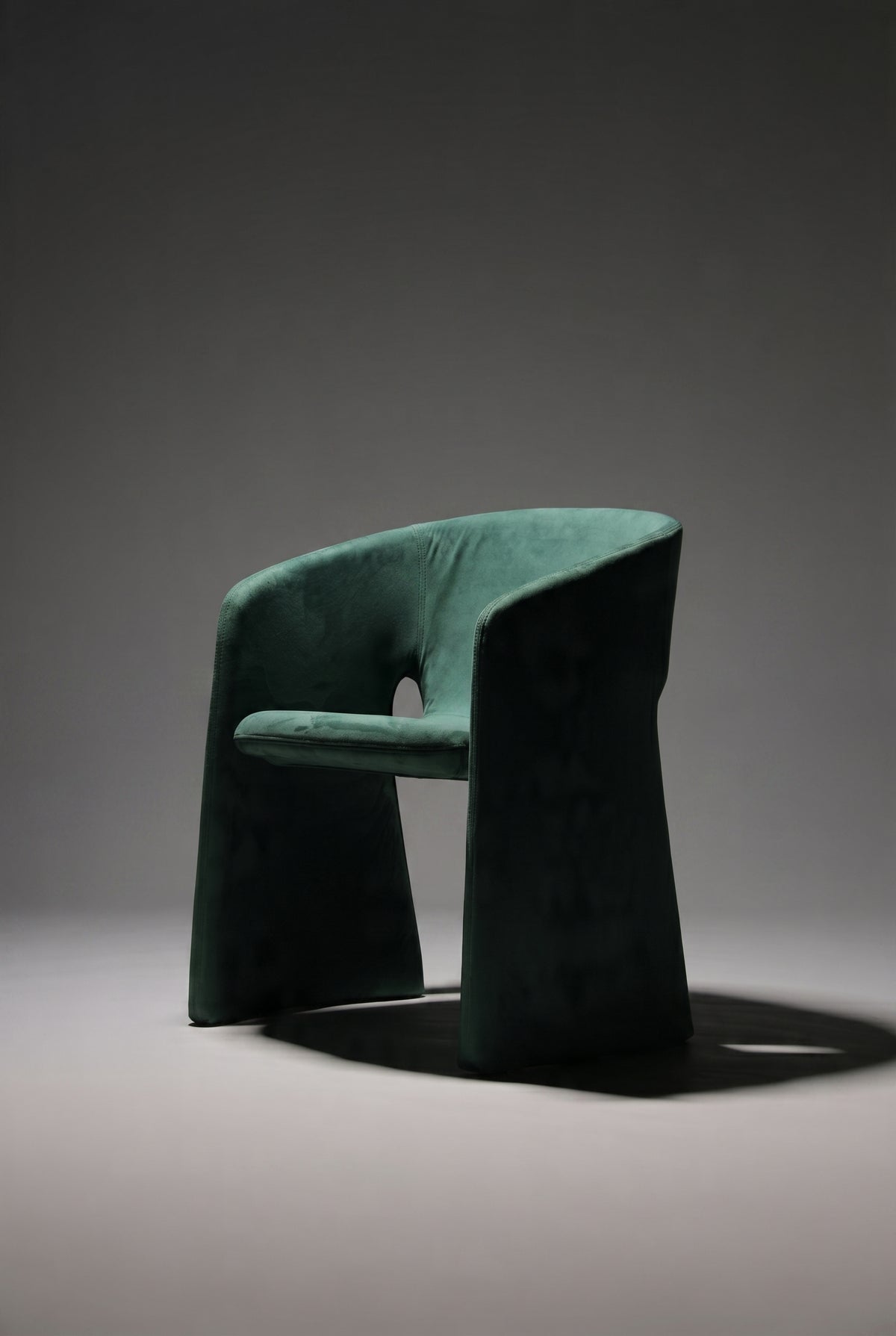 Green chair on a grey background