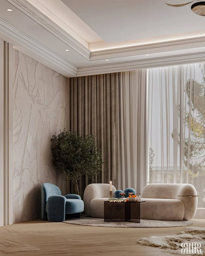 Modern living room with a beige sofa, blue armchair, and decorative items.