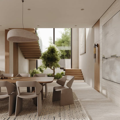 Modern interior design of a dining area with a table and chairs, large windows, and outdoor view.